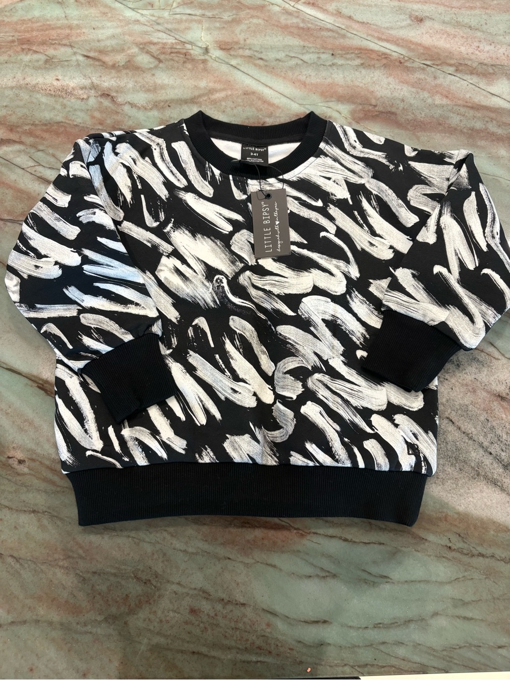 Little Bipsy Black Crewneck Sweater with White Brushstroke Print